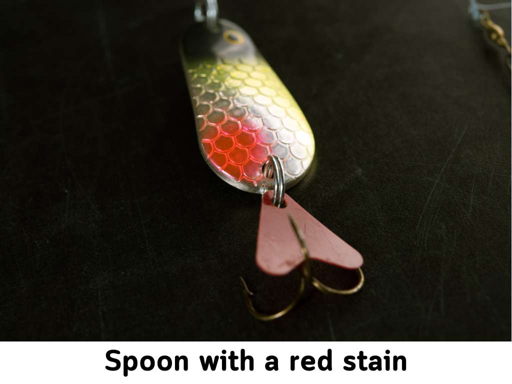 spoon with red stain